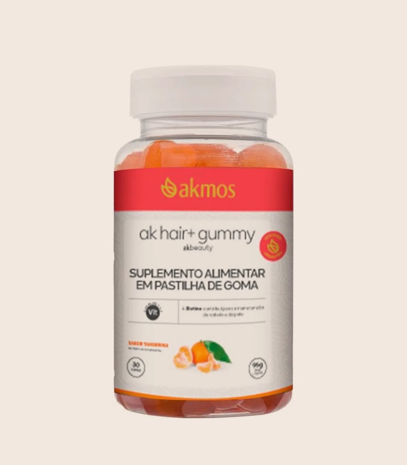 AK Hair+ Gummy, embalagem Akmos sobre fundo areia.