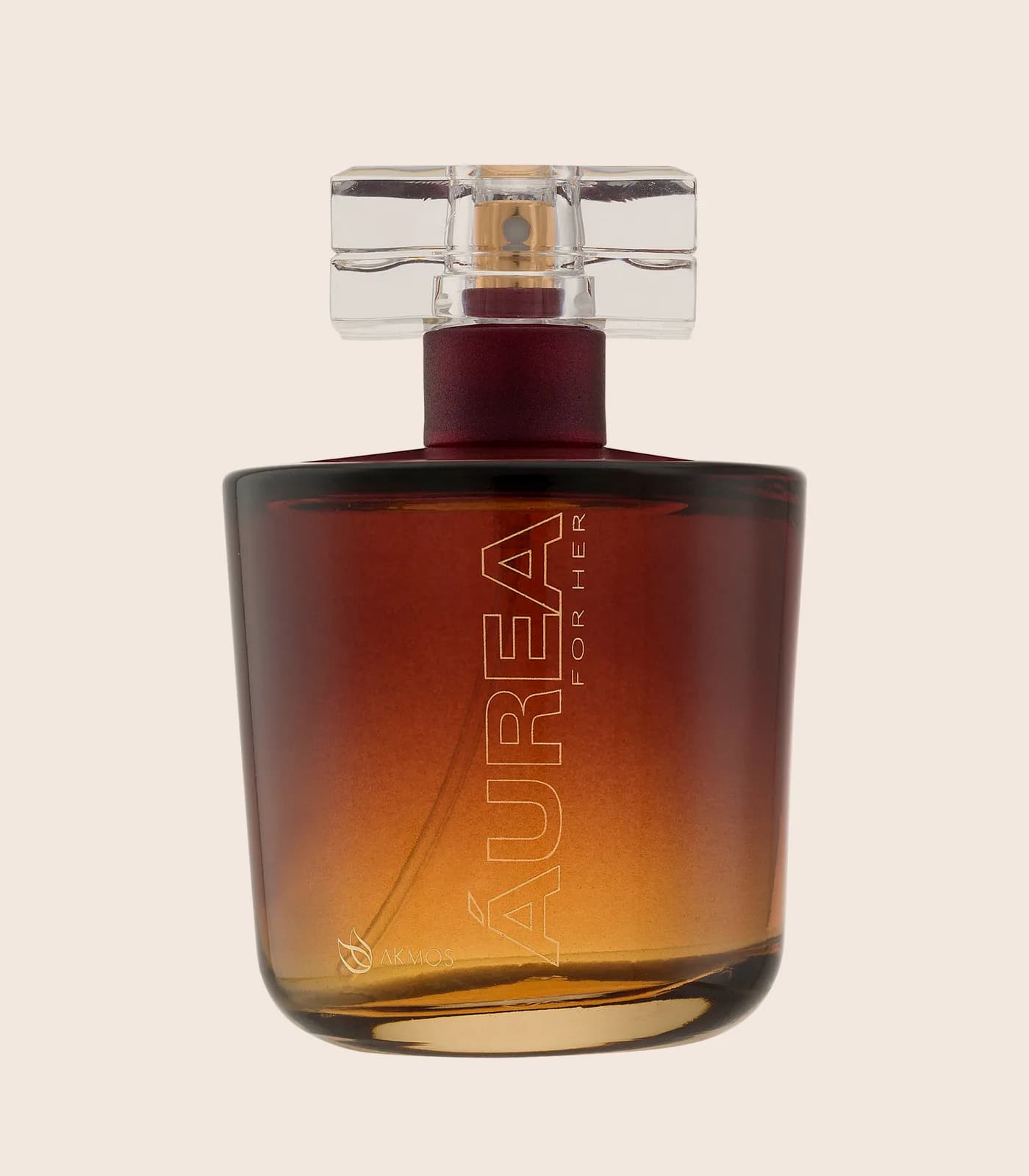 Perfume Aurea For Her, embalagem Akmos sobre fundo areia.
